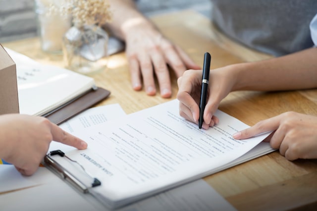 woman signing contract